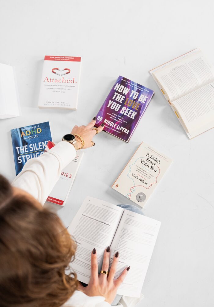person-on-floor-with-books
